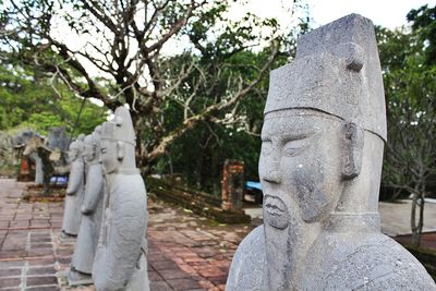 Statue of woman in cemetery