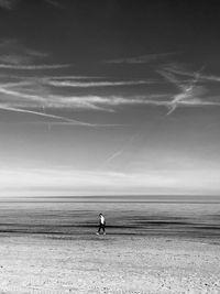 Man on beach against sky