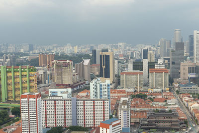 High angle view of modern buildings in city against sky
