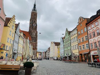 Street amidst buildings in city against sky