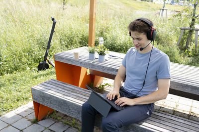 Portrait of young man using mobile phone