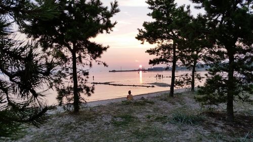 Scenic view of lake at sunset