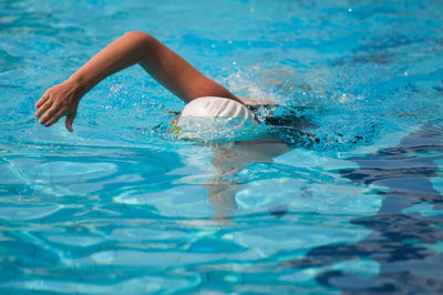 Woman swimming in pool