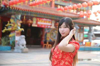 Portrait of woman standing outdoors