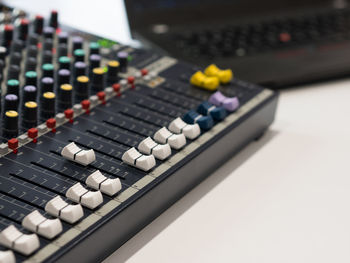 High angle view of sound mixer on white background