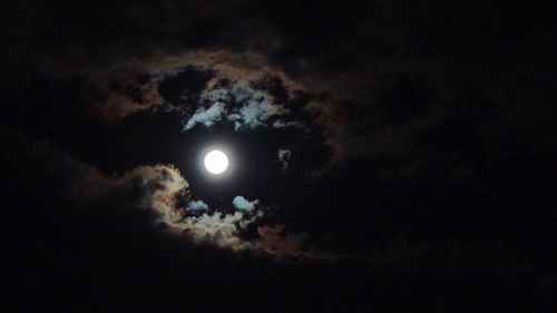 Low angle view of moon against sky at night