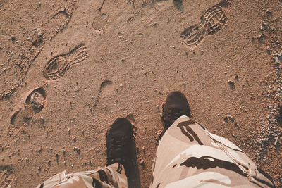 Low section of people standing on land