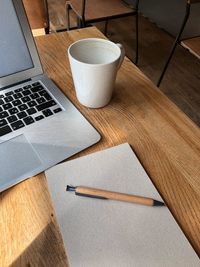 High angle view of coffee cup on table