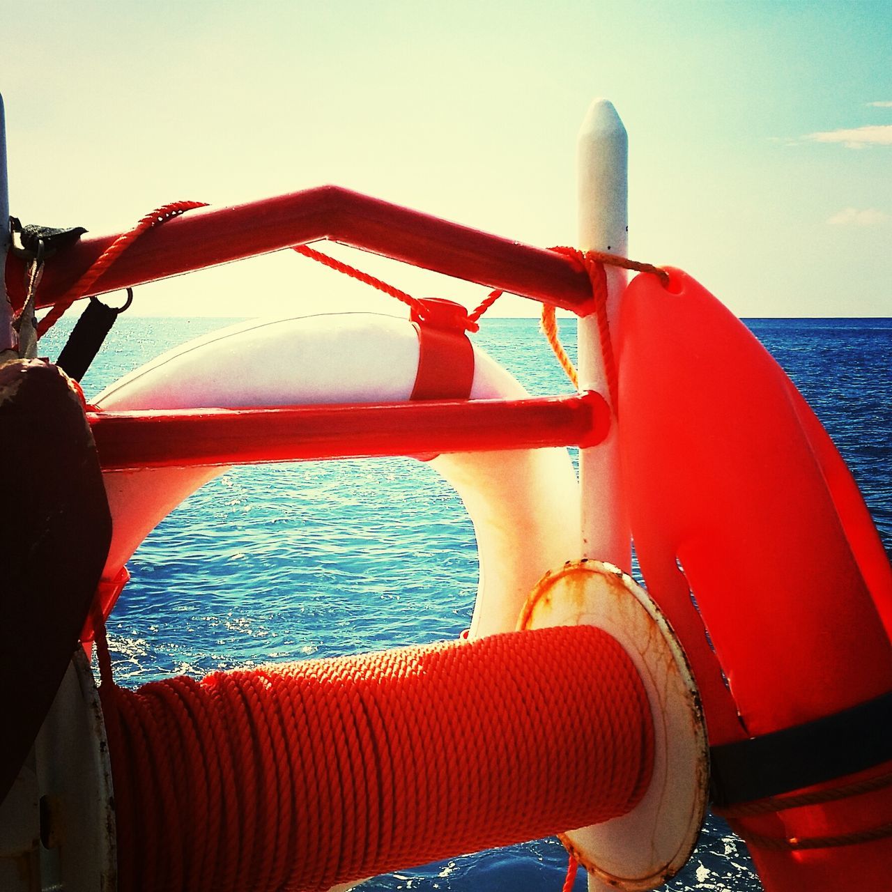 transportation, mode of transport, red, nautical vessel, part of, travel, boat, sea, land vehicle, water, cropped, sky, clear sky, close-up, outdoors, day, sailing, sunlight, journey, car