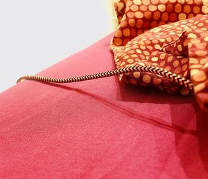 High angle view of straw on table against white background