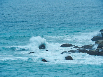 Waves splashing on rocks at shore