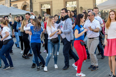 Group of people standing in town square