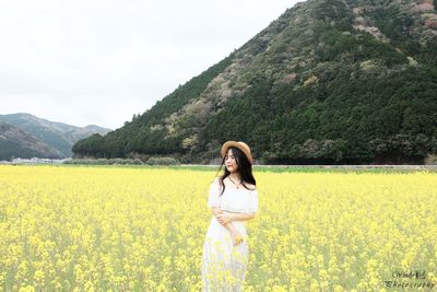 Full length of woman standing on field