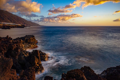 Scenic view of sea against sky during sunset