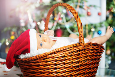 Midsection of woman holding wicker basket