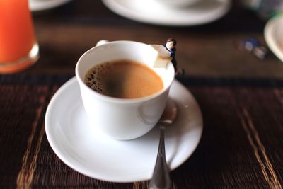 Close-up of coffee cup on table