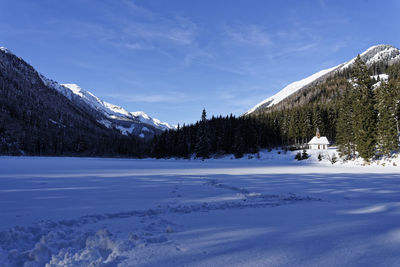 Scenic view of snowcapped mountains against sky