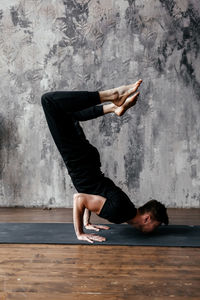 A man engaged in yoga and meditation, performing asanas