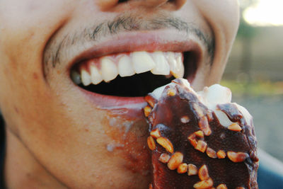 Close-up of man eating ice cream
