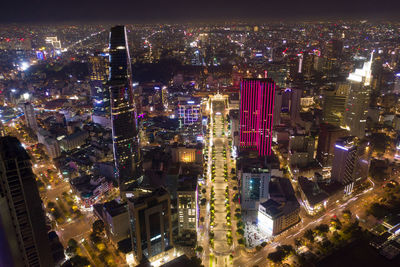 High angle view of city lit up at night