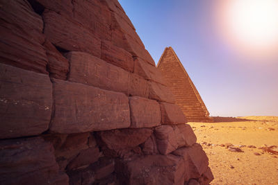  view of a pyramid of the black pharaohs in sudan with a view of a farther pyramid in the distance