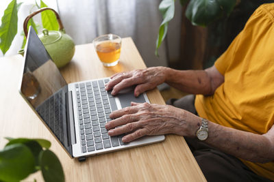 Woman using laptop at home