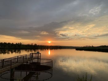 Scenic view of lake against sky during sunset