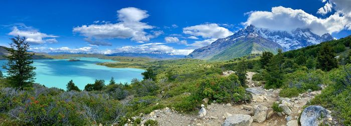 Panoramic view of trees and mountains against sky