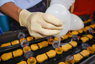 Cropped hand of man washing hands