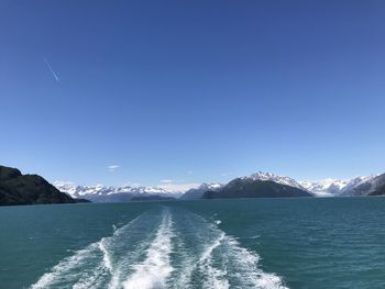 Scenic view of sea against clear blue sky