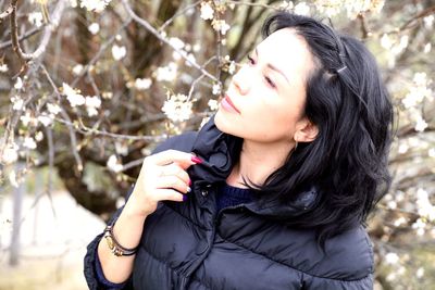 Portrait of woman against plants