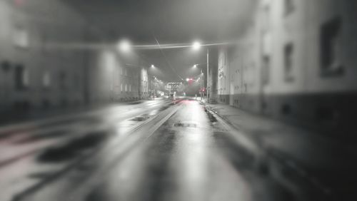 Road in illuminated city