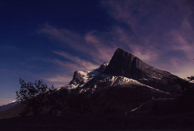 Low angle view of rocky mountains during winter