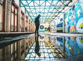 Reflection of people on mirror