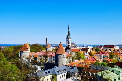 Townscape against clear blue sky