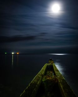 Scenic view of sea against sky at night