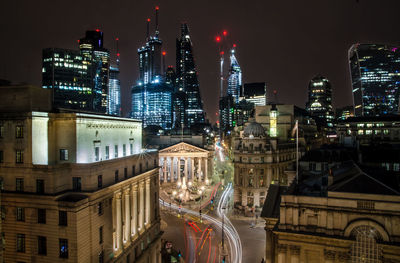 Aerial view of city lit up at night