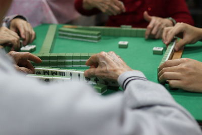 Midsection of man playing with toy