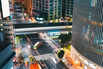 High angle view of illuminated city street and buildings