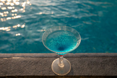 High angle view of drink in swimming pool