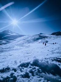 Scenic view of snow covered mountain against sky