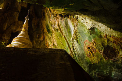 Low angle view of rock formation in water