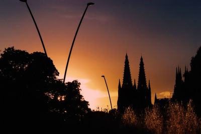 Low angle view of built structure at sunset