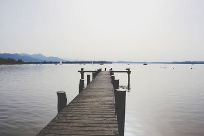 Pier over sea against sky