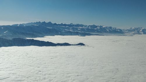 Scenic view of snowcapped mountains against clear sky