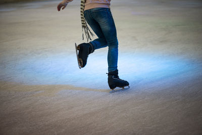 Low section of man skateboarding