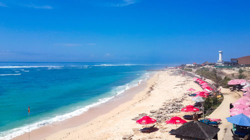 Scenic view of beach against blue sky