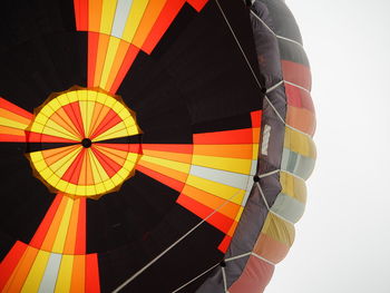 Low angle view of hot air balloon flying against sky