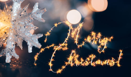 Close-up of illuminated christmas tree at night