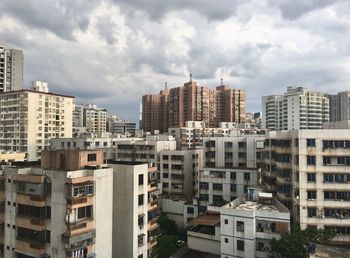 High angle view of buildings in city against sky